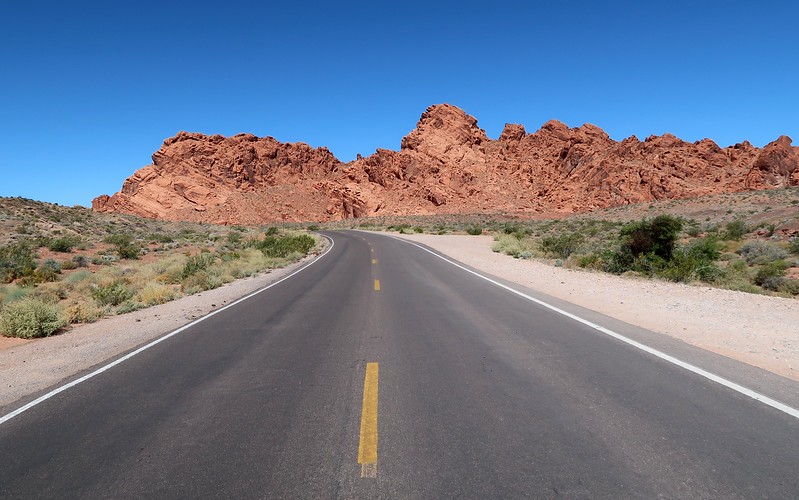Places to Travel in Nevada for Nature such as Valley of Fire State Park with epic roadside views with scenery off in the distance 