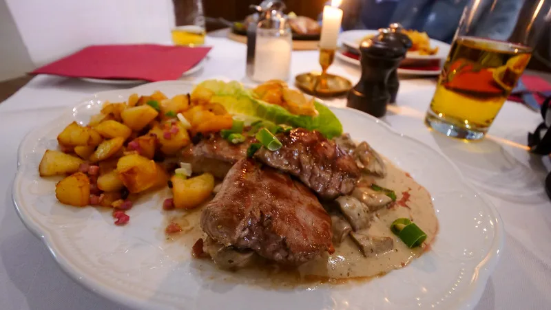 Pork medallions served in a creamy mushroom sauce for our hearty meal in Quedlinburg Pork medallions served in a creamy mushroom sauce for our hearty meal in Quedlinburg