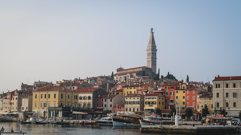 Postcard perfect shot of Rovinj from the marina highlighting the boats, buildings and distinct landmarks of this unique city in Croatia