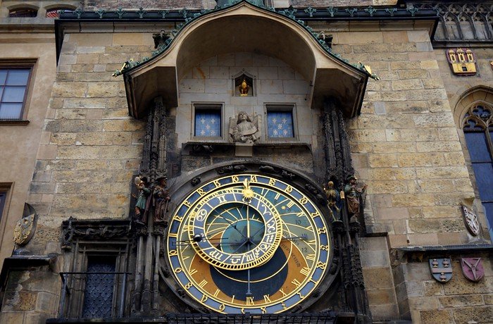 Close-up view of the intricate medieval Prague Astronomical Clock with golden zodiac details, mounted on the Old Town Hall in Old Town Square, Prague, Czech Republic