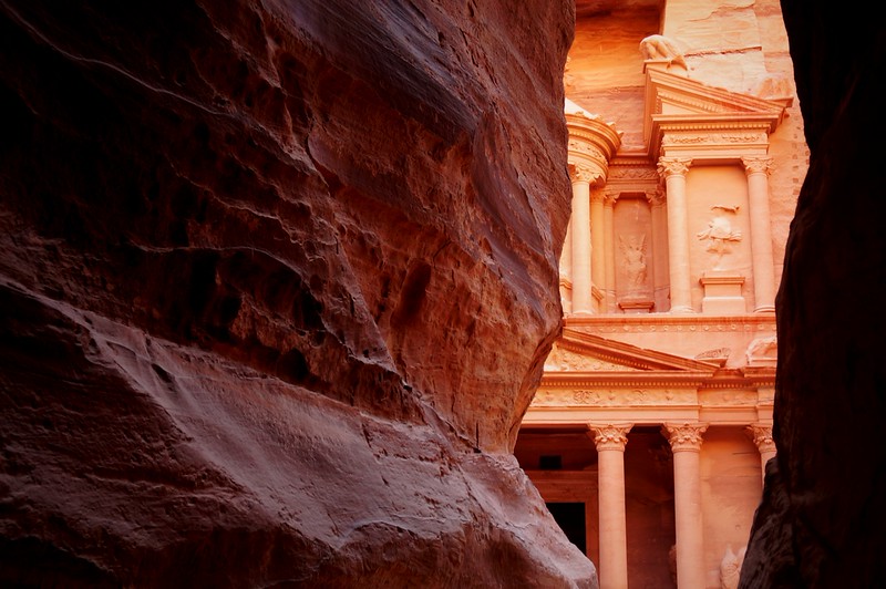 Reaching Petra also known as The Pink City as seen from the canyon revealing itself slowly for the first time leaving a lasting impression in Jordan