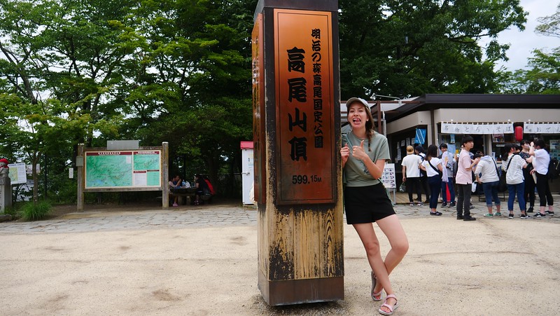 Reaching the summit of Mount Takao at 599 metres with That Backpacker Audrey Bergner giving two thumbs up