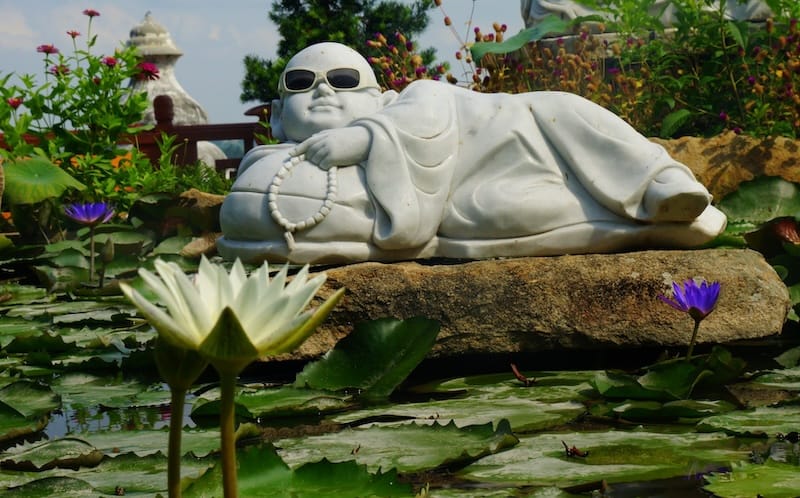 Reclining buddha wearing sunglasses on the Mekong Delta Tour in Vietnam Reclining buddha wearing sunglasses on the Mekong Delta Tour in Vietnam