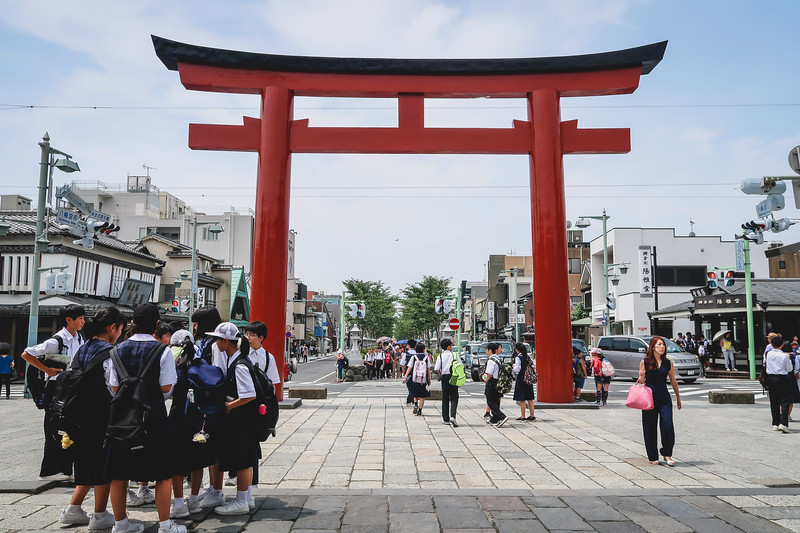 Red torii at Tsurugaoka Hachiman-gū in Kamakura, Japan with school children gathered together Red torii at Tsurugaoka Hachiman-gū in Kamakura, Japan with school children gathered together