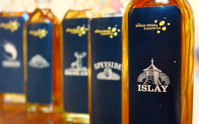 Regional whisky bottles for blending at the Scotch Whisky Experience in Edinburgh, Scotland featuring Islay, Speyside, Highland, and Grain labels Regional whisky bottles for blending at the Scotch Whisky Experience in Edinburgh, Scotland featuring Islay, Speyside, Highland, and Grain labels