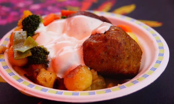 Reindeer meatballs with potatoes, vegetables, and garlic sauce for a meal in Helsinki, Finland 