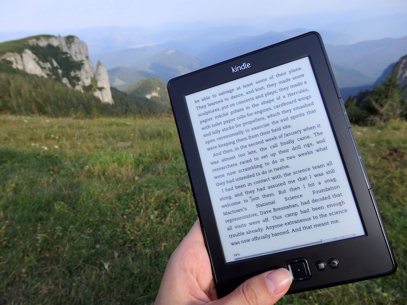 Relaxing by reading my kindle after hiking Ceahlau National Park in Romania 
