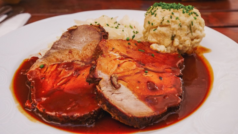 Roast beef with gravy and potato dumplings - Austrian cuisine worth trying 