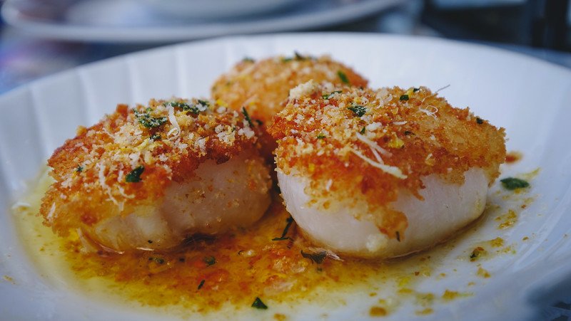 Scallops with a herbed crumb crust, lemon, white wine and garlic butter at The Bicycle Thief in Halifax, Nova Scotia, Canada