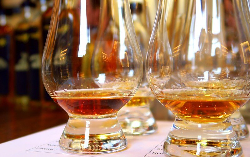 Close-up of Glencairn glasses with Scotch whisky samples for nosing and tasting at a whisky experience in Edinburgh, Scotland