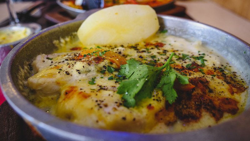 Delicious seafood gratin served at El Náutico Cantina, one of the best restaurants in Puerto Madryn, Patagonia, Argentina. The creamy baked dish topped with herbs and spices is a local favorite, perfect after a day exploring Peninsula Valdes