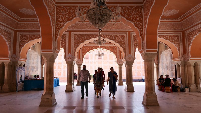 Seeing pink in Jaipur walking through elegant archways with intricate design and details on full display in Rajasthan 