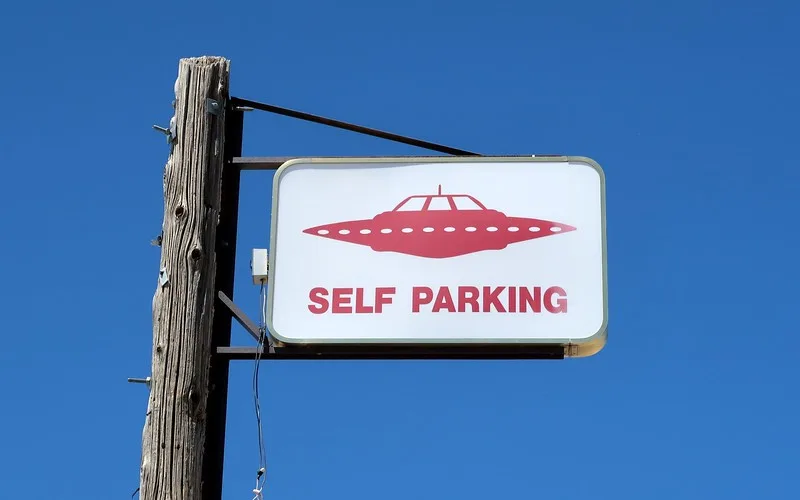 Self-parking for UFOs at Little A'le'inn signboard with UFO icon spotted on our Nevada road trip in the USA