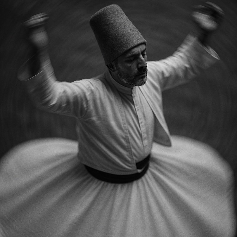 Sema whirling dervish man in motion with motion blur aplenty 