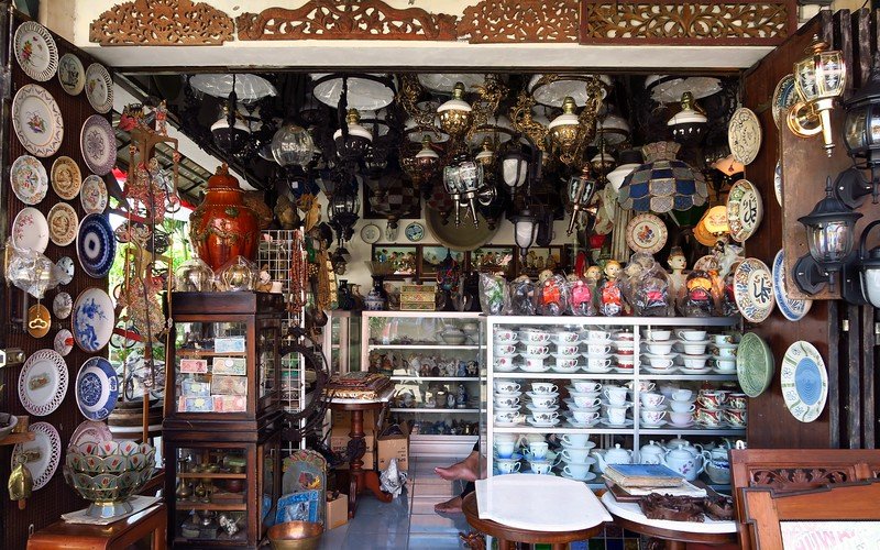 Shopping for antiques at Triwindu Market in Solo, Indonesia with shops offering unique and distinct souvenirs and various trinkets 