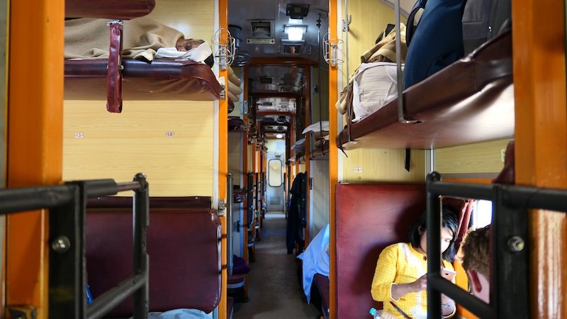 Sleeper train ride in India adventure travel interior views of beds and bunks 