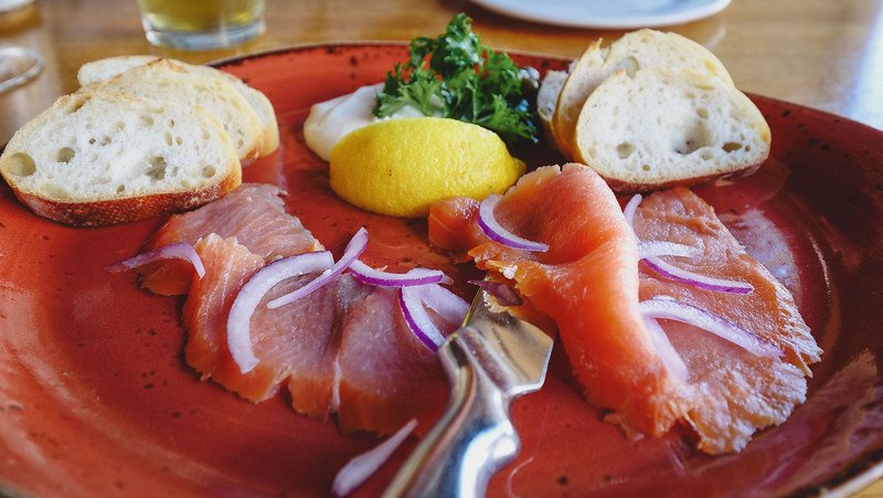 Smoked salmon with sour cream, capers, red onions and bread as an appetizer at Salty's in Halifax, Nova Scotia