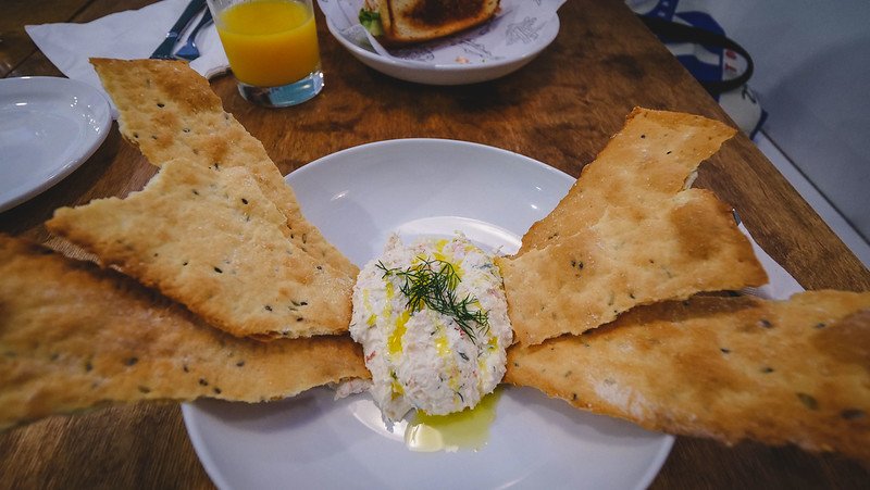 Snow crab and cream cheese dip with dill and homemade crackers making it the perfect appetizer on our food tour in Halifax