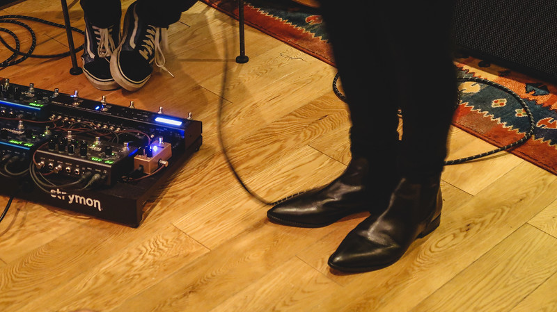 Sofar Sounds in London macro detail views of shoes and soundboards at ground level in England 