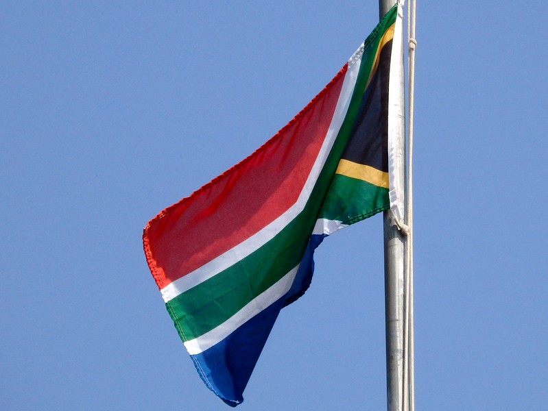 South African flag flapping in the wind whilst on safari
