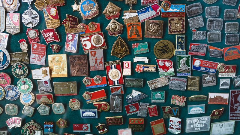 Souvenirs at the Antique Shop in Karakol, Kyrgyzstan including various pins and magnets in all shapes, sizes and configurations 