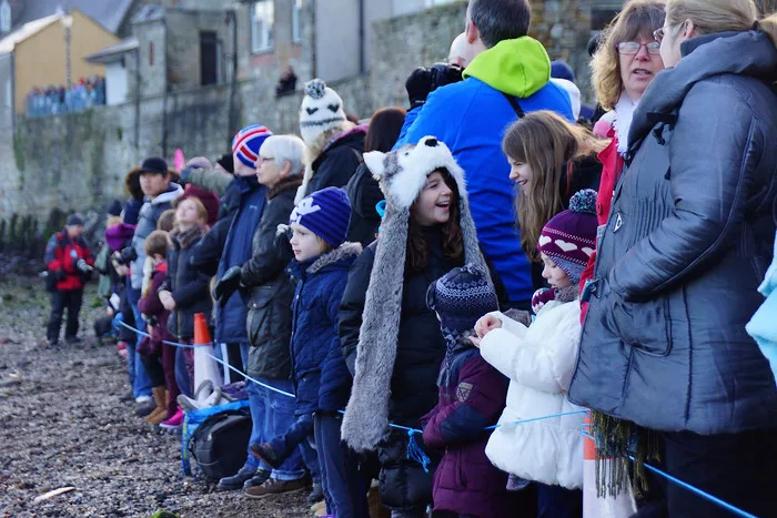 Spectators at the Loony Dook enjoying the event with nothing but big smiles in Scotland