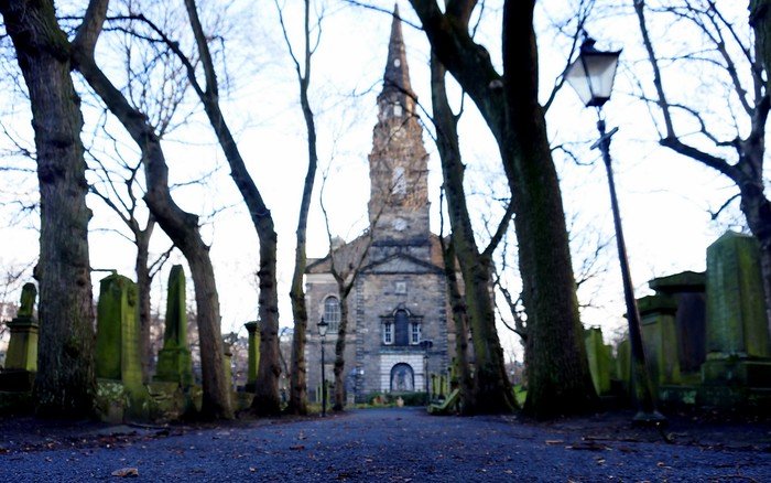 St. Cuthbert's Church and Burial Ground in Edinburgh, Scotland giving off a spooky vibe on an atmospheric day