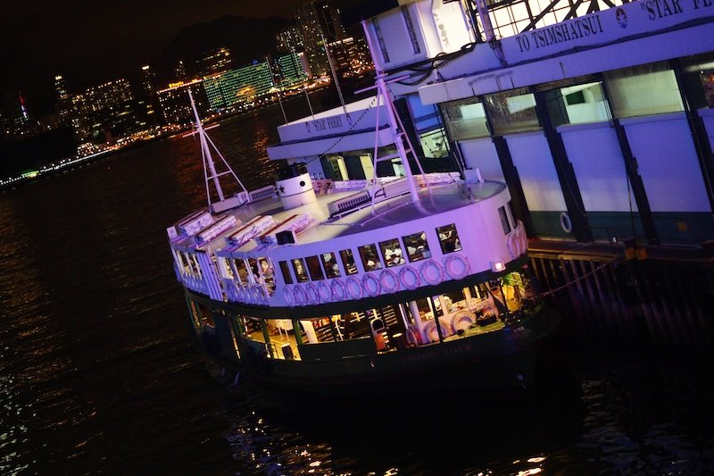 Star ferry crossing from Kowloon to Hong Kong Island at night 