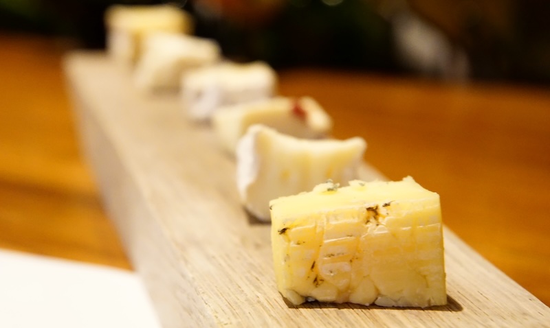 Stellenbosch wine pairing with cheese lined up on the board in South Africa 