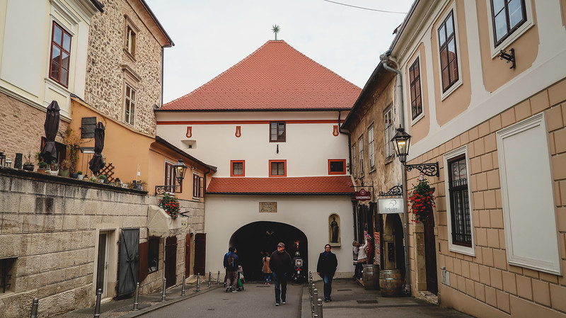Stone Gate in Zagreb with its unique and distinct architectural design and pedestrians walking in and around the area in Croatia 