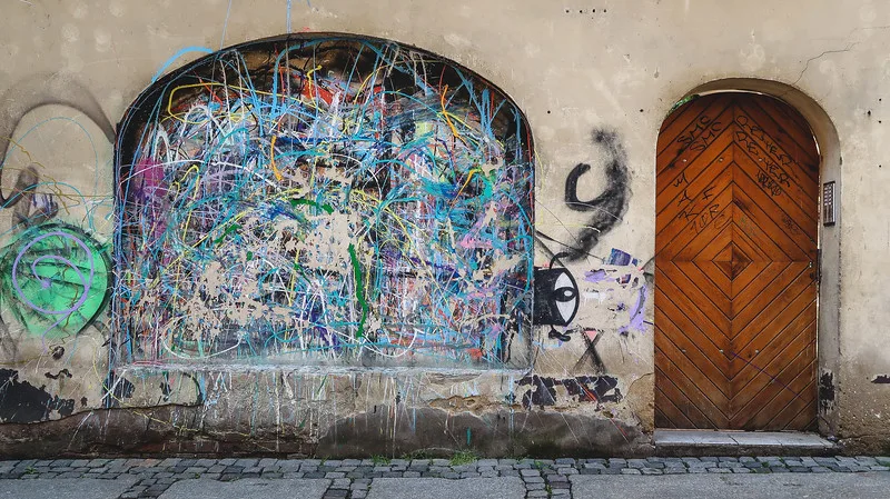 Street art in Poznan on a gritty side street next to a door Street art in Poznan on a gritty side street next to a door