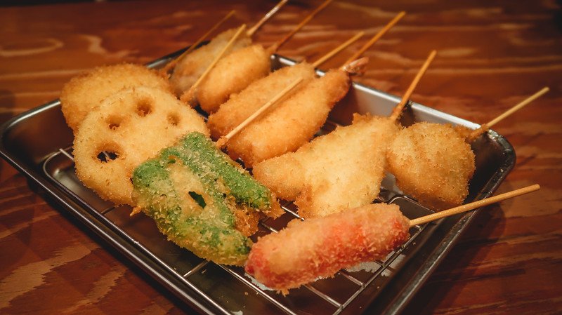 Street food is a must try on any visit to Osaka including deep-fried assorted items on a stick!