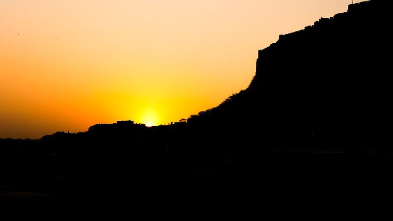 Sunset in Jodhpur offering fiery sky and silhouette views of the fort