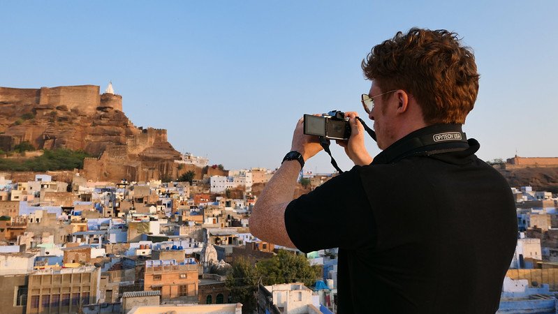 Sunset views of Mehrangarh Fort with Nomadic Samuel capturing it all from a rooftop vantage point in Jodhpur the Blue City of Rajasthan 