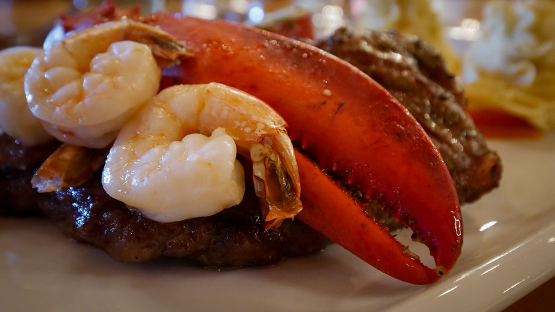 Surf 'N Turf with a steak and a lobster claw for the ultimate seafood feast on Cape Breton, Nova Scotia, Canada