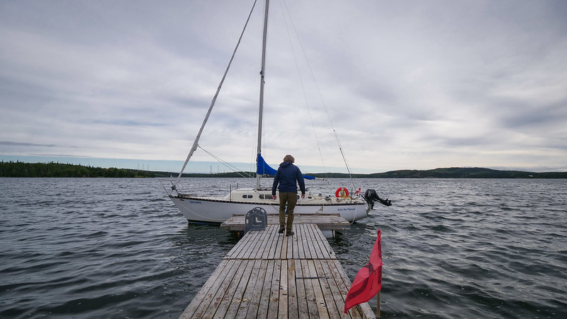 Taking a sailing Tour of St. Peters Canal in Southern Cape Breton with Nomadic Samuel walking towards the boat prior to boarding 