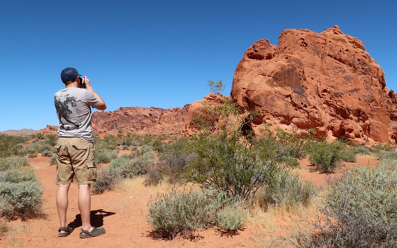 Taking photos of the red sandstone boulders at Valley of Fire with Nomadic Samuel behind the camera Taking photos of the red sandstone boulders at Valley of Fire with Nomadic Samuel behind the camera