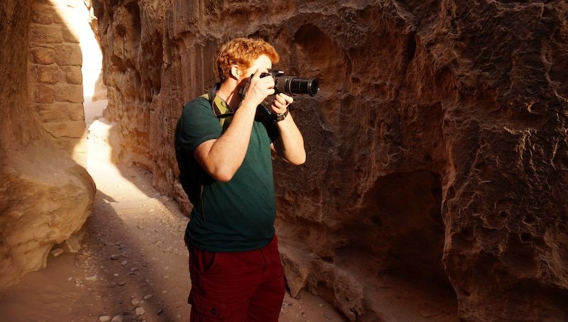 Taking photos with a dSLR camera at Petra, Jordan is Nomadic Samuel Taking photos with a dSLR camera at Petra, Jordan is Nomadic Samuel
