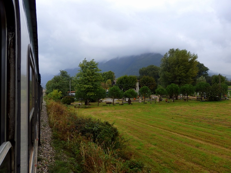 Taking the train to Chiavenna, Italy with scenic countryside views outside of our window 
