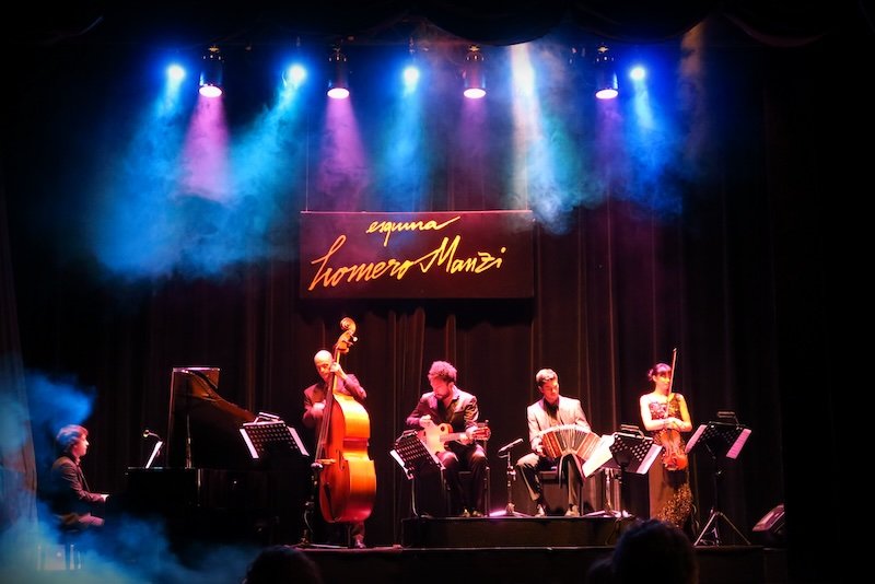 Tango show performers playing music and delighting crowds in Buenos Aires, Argentina 