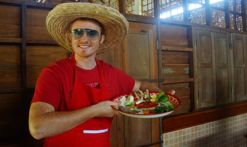 Thai cooking ingredients on a tray with Nomadic Samuel ready to learn how to ake Thai dishes at a cooking school in Chiang Mai, Thailand 