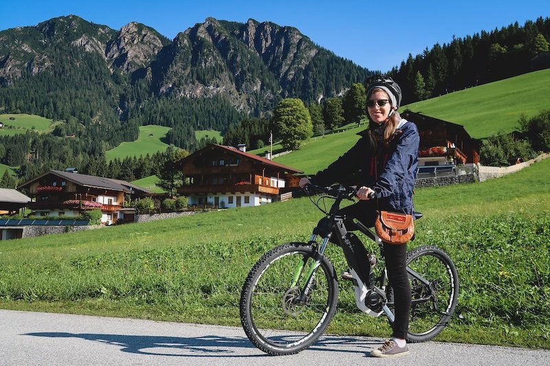 That Backpacker Audrey Bergner dressed for autumn weather and e-biking adventure visiting Austrian Alps in Tyrol, Austria during fall in Europe That Backpacker Audrey Bergner dressed for autumn weather and e-biking adventure visiting Austrian Alps in Tyrol, Austria during fall in Europe