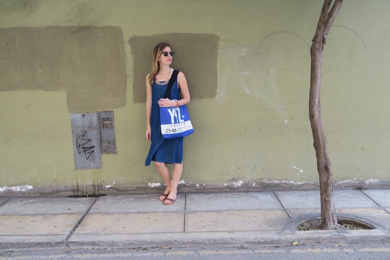 That Backpacker Audrey Bergner looking fashionable in Lima, Peru with sunglasses, dress and tote bag as an accessory item backpacking South America 