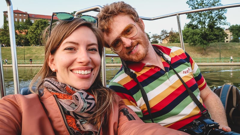 That Backpacker Audrey Bergner and Nomadic Samuel all smiles enjoying our boat tour in Krakow, Poland That Backpacker Audrey Bergner and Nomadic Samuel all smiles enjoying our boat tour in Krakow, Poland