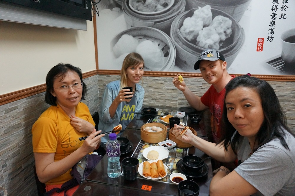 That Backpacker Audrey Bergner and Nomadic Samuel and friends feasting together in Hong Kong  