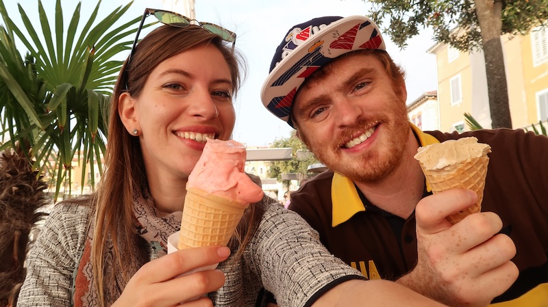 That Backpacker Audrey Bergner and Nomadic Samuel slurping delicious ice cream gelato in Rovinj, Croatia 