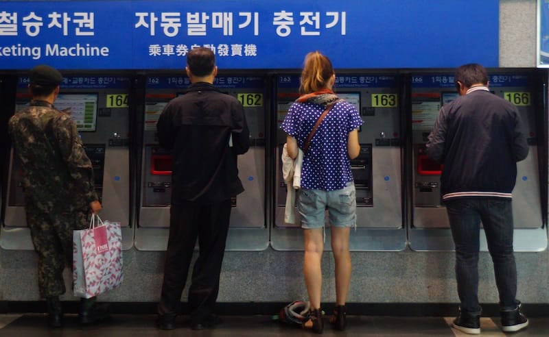 That Backpacker Audrey Bergner buying train tickets in Seoul, Korea 