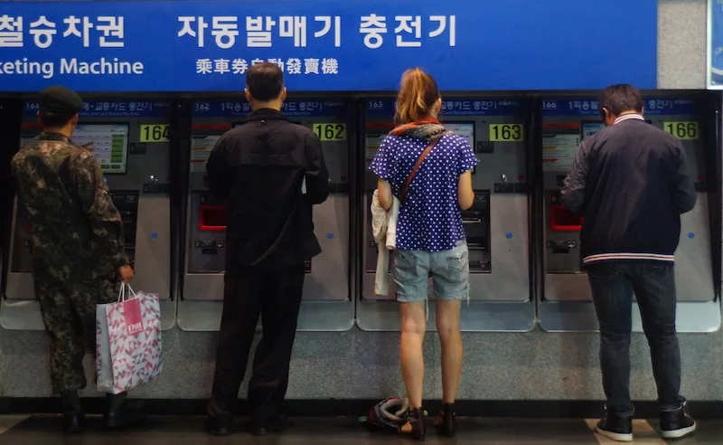 That Backpacker Audrey Bergner buying train tickets in Seoul, Korea 