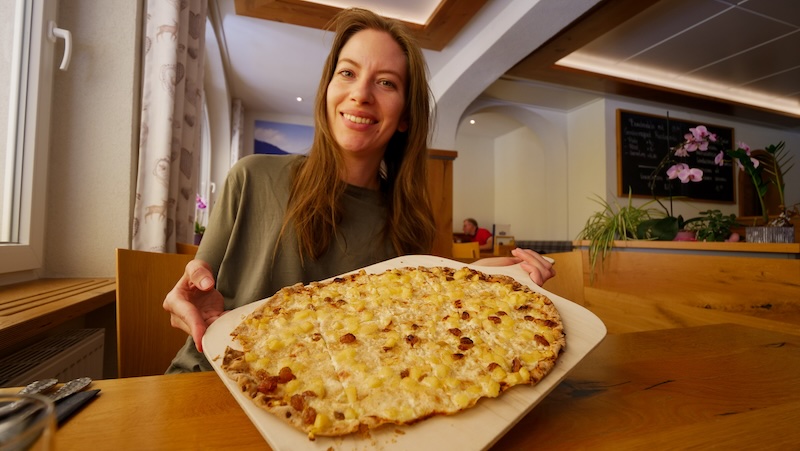 That Backpacker Audrey Bergner enjoying a giant German pizza during the Black Forest road trip That Backpacker Audrey Bergner enjoying a giant German pizza during the Black Forest road trip