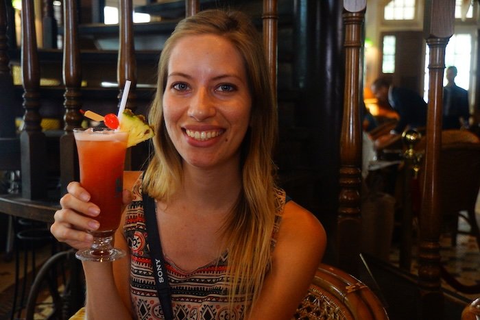 That Backpacker Audrey Bergner enjoying a Singapore sling at the Raffles hotel whilst backpacking in Singapore on a SE Asia trip 
